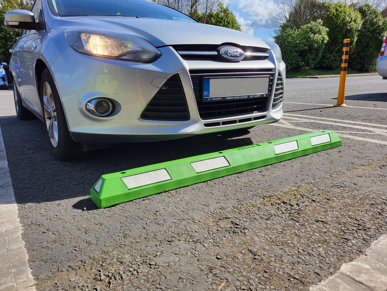 Green XPT wheel stop stopping car from rolling forward